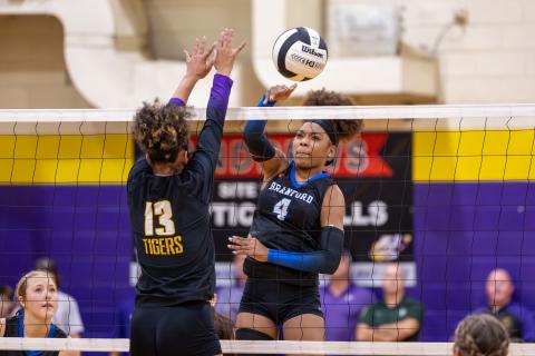Branford hitter Adriauna Combs (4) and Union County hitter Jailyn Simmons (13) battle at the net during the District 6-R championship on Thursday. (JACK HOWDESHELL/Lake City Reporter)