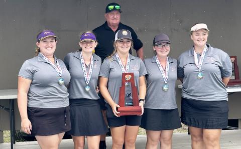 Columbia’s girls golf team smiles with the District 2-2A trophy on Tuesday. (COURTESY)