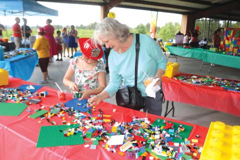 Denise Barth (right) works with 7-year-old Rowan Barth during Monday’s event. (TONY BRITT/Lake City Reporter)