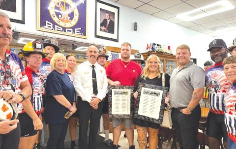 Firefighters and Elks Lodge #990 members celebrate after participating in the Brotherhood Ride from Marion County to Gainesville. The ride is meant to honor fallen first responders. (COURTESY)