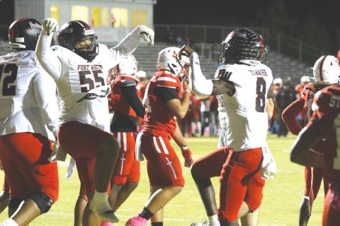 Fort White quarterback Jayden Jackson (right) and offensive lineman Tayvin Fleming celebrate following Jackson’s first touchdown during last Friday’s 35-6 win over Hamilton County. (MORGAN MCMULLEN/Lake City Reporter)