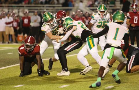 Suwannee defensive ends Reese Bronson (55) and Kyler Watson (24) tackle Chiles receiver Cade Frier on Thursday. (PAUL BUCHANAN/Lake City Reporter)