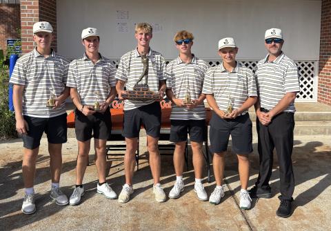 The Suwannee boys golf team shows off its trophy after winning the Ann and John Ives Invitational on Thursday. (COURTESY)