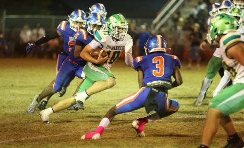 Suwannee quarterback Koy Frier scrambles up the field against Taylor County on Friday. (PAUL BUCHANAN/Lake City Reporter)