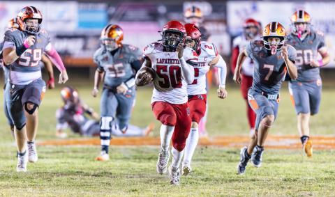 Lafayette’s Zamarion Hawkins returns a fumble for a touchdown against Trenton on Friday. (JACK HOWDESHELL/Lake City Reporter)