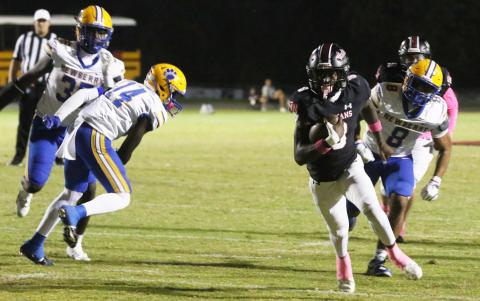Fort White’s Jayden Jackson races for a 16-yard touchdown run against Newberry on Friday. (MORGAN MCMULLEN/Lake City Reporter)