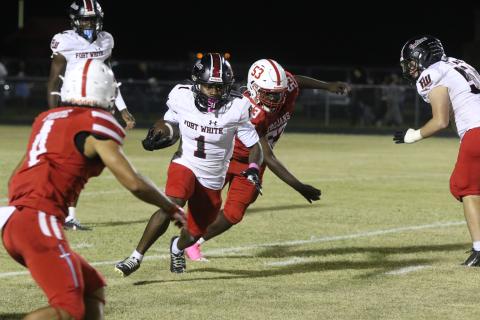 Fort White running back John’l Lawson looks for room up the sideline against Hamilton County on Friday. (MORGAN MCMULLEN/Lake City Reporter)