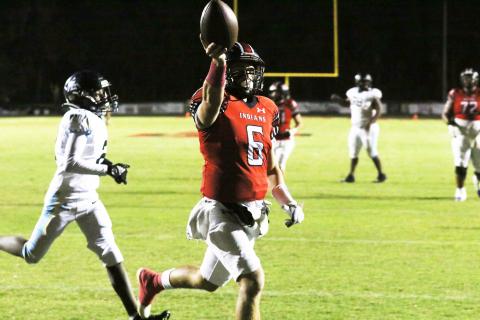 Fort White quarterback Matthew Pitts celebrates after a touchdown Friday against Zarephath Academy. (MORGAN MCMULLEN/Lake City Reporter)