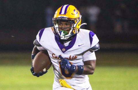 Columbia running back Jeffery Pope looks for running room against Ridgeview on Friday. (BRENT KUYKENDALL/Lake City Reporter)