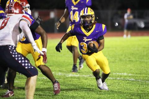 Columbia running back Drew Simmons looks for running room against Manatee last Friday. (BRENT KUYKENDALL/Lake City Reporter)