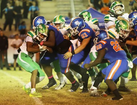 Suwannee running back Lou Jack Smith is corralled by Taylor County defenders on Oct. 17. (PAUL BUCHANAN/Lake City Reporter)