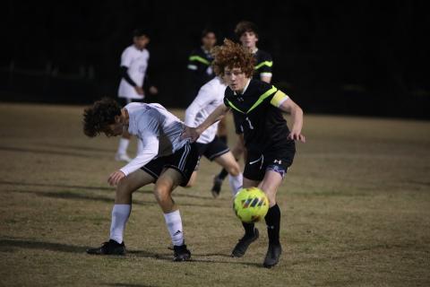 Columbia's Brendan Schwartz chases after possession of the ball during a match against Gainesville last season. (BRENT KUYKENDALL/Lake City Reporter)