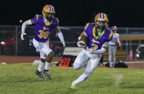 Columbia safety Julian De La Cruz returns an interception against Bolles on Oct. 31. (BRENT KUYKENDALL/Lake City Reporter)
