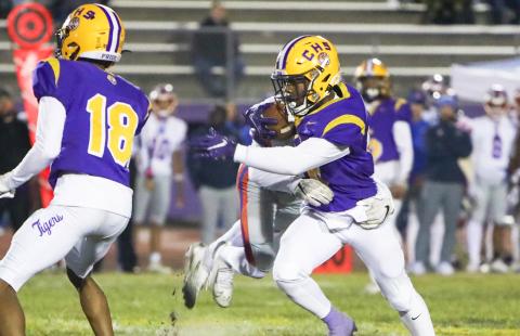 Columbia quarterback Xavier Collins tries to escape a Bolles’ tackler during Friday’s 31-0 loss. (BRENT KUYKENDALL/Lake City Reporter)