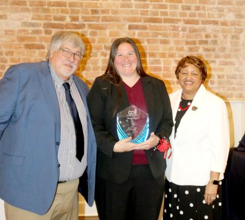Briana Collier, a Lake City Middle School math teacher, was named the Columbia County School District’s Teacher of the Year on Thursday. She received her award from Superintendent Keith Couey and School Board Chair Narrie Smith. (TONY BRITT/Lake City Reporter)