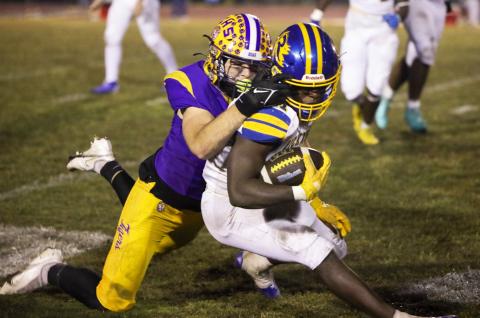 Columbia defensive end Kyten Davis tackles Rickards running back Karlise Price during last Friday’s Region 1-4A quarterfinal. (BRENT KUYKENDALL/Lake City Reporter)