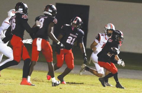 Fort White defensive back Mason Butler returns an interception against Baker County on Oct. 31. (MORGAN MCMULLEN/Lake City Reporter)