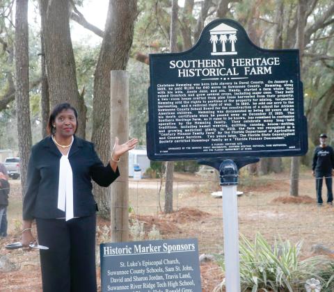 Pat Hines Mitchell talks about the Southern Heritage Historical Farm’s historical marker after it was unveiled Saturday during a ceremony at the farm southwest of Live Oak. (JAMIE WACHTER/Lake City Reporter)