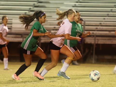 Columbia's Leah Shields dribbles in to score a goal against Suwannee on Thursday. (PAUL BUCHANAN/Lake City Reporter)