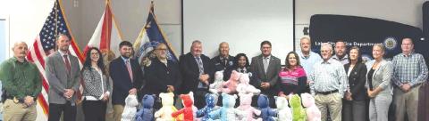 Representatives from the Columbia Correctional Institution and Lake City Police Department teamed up to give local inmates the materials necessary to build teddy bears to be used for kids in domestic violence situations. (COURTESY LAKE CITY POLICE DEPARTMENT)