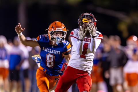 Lafayette receiver Kaeden Woods catches a pass in front of Branford defensive back Tripp Schultz on Oct. 24. (JACK HOWDESHELL/Lake City Reporter)
