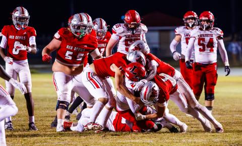 Lafayette quarterback Tywan Williamson gets buried by the Williston defense during Friday night’s Class Rural quarterfinal. (JACK HOWDESHELL/Lake City Reporter)