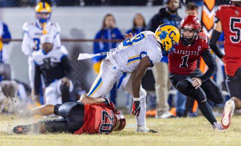 Lafayette linebacker Trevor Byrd (1) comes in to assist Alex Townsend (20) on a tackle against Chipley’s Jakobe McKinnie on Oct. 31. (JACK HOWDESHELL/Lake City Reporter)