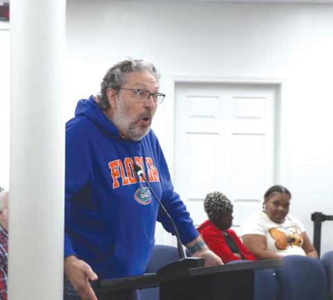 Former Lake City Councilman Todd Sampson (left) addresses the council regarding its housing plan during Monday’s workshop. (MORGAN MCMULLEN/Lake City Reporter)