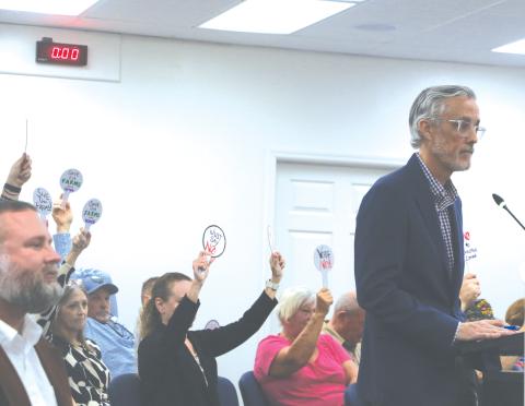 Price Creek LLC attorney Patrick Krechowski (right) addresses the Lake City Council in front of protesting Price Creek residents during Monday’s meeting. (MORGAN MCMULLEN/Lake City Reporter)