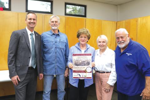 Blue-Grey Army officials unveiled the 2026 Olustee Festival Poster at their meeting Tuesday with Columbia County Clerk of Court Jay Swisher (from left), Past Commanding General General Tom Coleman, Mantha Young of Mac Media, Blue-Grey Army Executive Director Faye Warren and Commanding General Tony Buzzella. (TONY BRITT/Lake City Reporter)