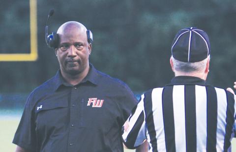 Fort White coach Demetric Jackson stares down a referee during a game last season. (FILE)