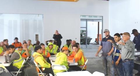 Keith Hudson (right), a Columbia County School Board member, offers construction workers a personal ‘Thank You’ for their work on the new Eastside Elementary during a topping-off ceremony and luncheon at the building on Tuesday morning. (TONY BRITT/Lake City Reporter)