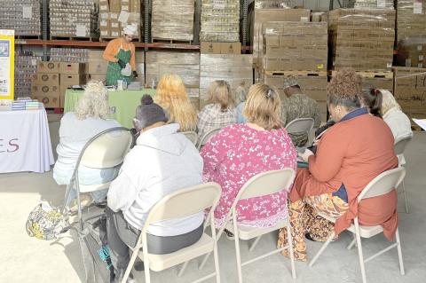 Second Harvest provided a Holiday Pantry to Plate Cooking Demonstration as part of the Christmas Cheer Bags program Wednesday at Catholic Charities. (COURTESY)