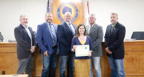 Suwannee County Economic Development Coordinator Charissa Setzer recently earned her Basic Economic Development Certification from the University of South Florida. Setzer was honored for the achievement at Tuesday’s Suwannee County Commission meeting by Economic Development Director Jimmy Norris (from left) and Commissioners Leo Mobley, Don Hale, Franklin White and Travis Land. (JAMIE WACHTER/Lake City Reporter)