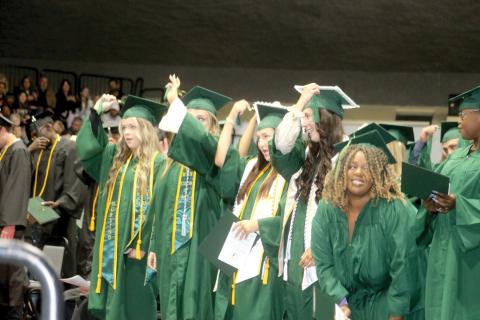 Florida Gateway College graduates turn their tassels after graduating during the college’s commencement ceremony Tuesday evening at the Howard Center. (TONY BRITT/Lake City Reporter)