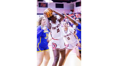 Fort White forward Jahlaya Wilson struggles to get a shot off while surrounded by the Newberry defense on Friday. (JACK HOWDESHELL/Lake City Reporter)