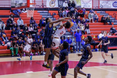 Fort White guard Desean Lally has his shot blocked by Newberry forward Brandon Kelly on Friday. (JACK HOWDESHELL/Lake City Reporter)