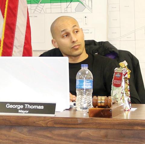 Fort White Mayor George Thomas listens as Town Attorney Rhett Bullard speaks during Monday night’s meeting. Thomas later abruptly stormed out of the meeting during a heated debate about meeting decorum. (TONY BRITT/Lake City Reporter)