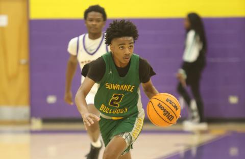 Suwannee guard Jalen Hampton dribbles the ball up the court against Columbia on Dec. 12. (PAUL BUCHANAN/Lake City Reporter)