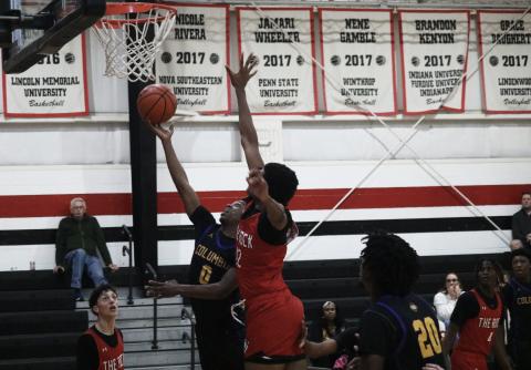 Columbia guard Murkail Cray (0) tries to get a shot off while defended by The Rock center Jafari Hicks on Tuesday. (JORDAN KROEGER/Lake City Reporter)