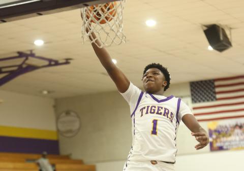 Columbia guard Shaheed White drives to the basket for a layup against Suwannee on Friday. (PAUL BUCHANAN/Lake City Reporter)