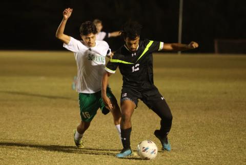 Columbia's Josiah Hopkins gathers possession of the ball while defended by Suwannee's Aksel Perez on Dec. 1. (PAUL BUCHANAN/Lake City Reporter)
