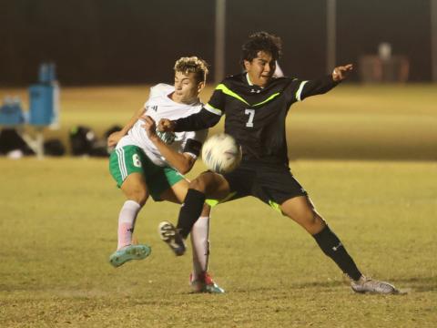 Suwannee's Colt Lee (6) and Columbia's Roger De La Cruz (7) fight for possession for the ball during Monday's match at CYSA. (PAUL BUCHANAN/Lake City Reporter)