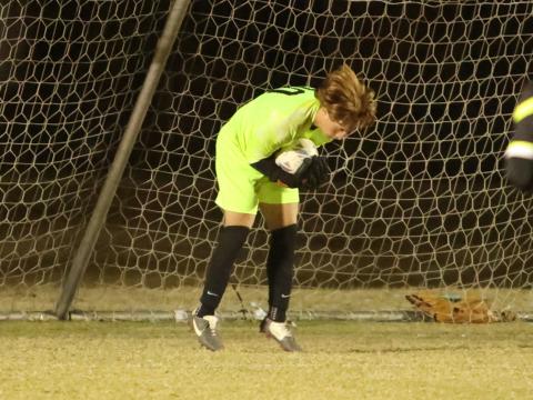Columbia goalkeeper Logan Wheeldon makes a save against Suwannee on Dec. 1. (PAUL BUCHANAN/Lake City Reporter)