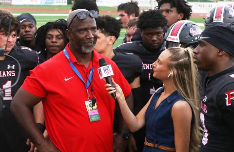 Fort White coach Demetric Jackson is interviewed by a reporter following the Indians’ 32-29 win over Port St. Joe in the FIT championship on Friday. (MORGAN MCMULLEN/Lake City Reporter)