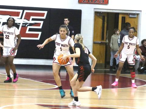 Fort White guard Mariah Cox (1) defends against Trenton's Grace Griffis during Tuesday's 70-22 win. (MORGAN MCMULLEN/Lake City Reporter) 