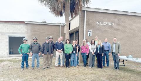 Suwannee County School District officials and representatives from Scorpio held a topping out ceremony Monday on the new nursing building addition at RIVEROAK Technical College. (COURTESY TJ VICKERS/Suwannee County School District)