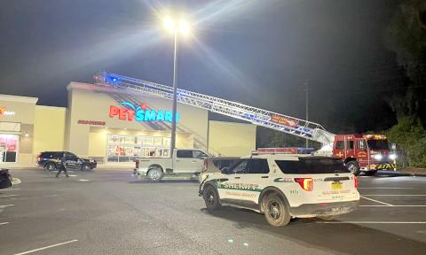 A special needs child was rescued from the roof of PetSmart on Wednesday night by Lake City police officers and Lake City firefighters. (COURTESY LAKE CITY FIRE DEPARTMENT)