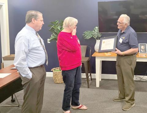 Meally Jenkins, the founder of the Christmas Dream Machine, reacts as the Rotary Club of Lake City Sunrise recognized her as a Paul Harris Fellow during its Dec. 3 meeting. (COURTESY ROTARY CLUB OF LAKE CITY SUNRISE)