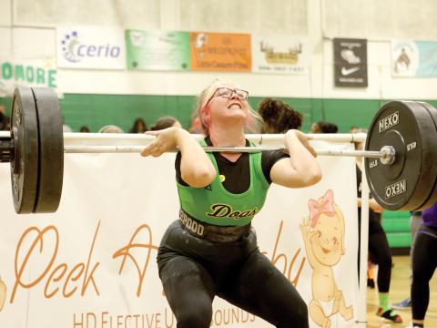 Suwannee lifter Felicity May strains as she competes Saturday at the Power of Christmas meet at SHS. May placed fourth in the 199 division. (PAUL BUCHANAN/Lake City Reporter)